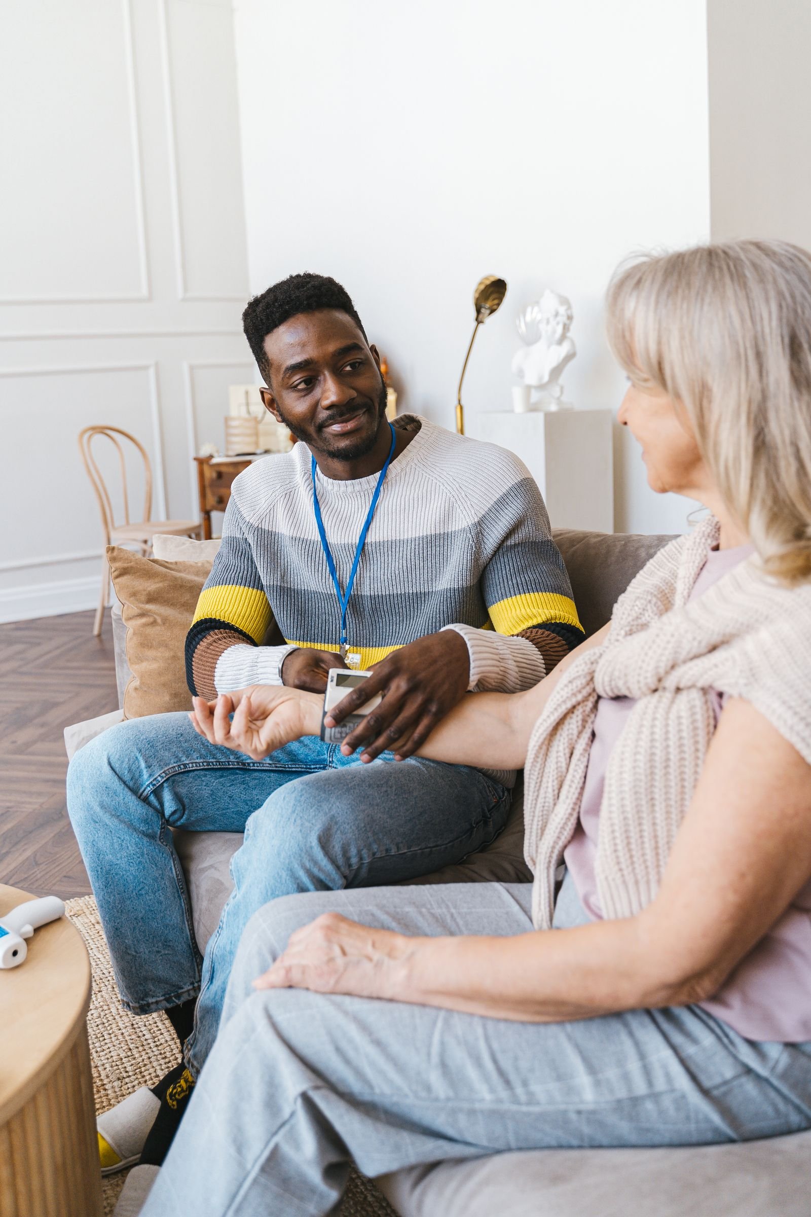 A compassionate care coordinator meeting with a senior