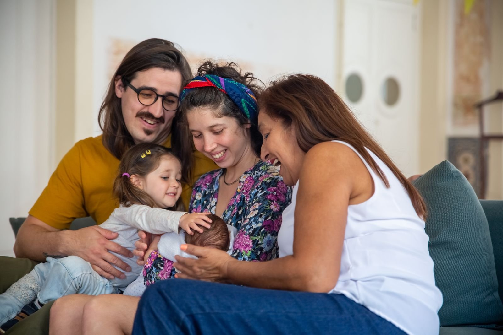 Three generations of a family sharing a warm moment at home